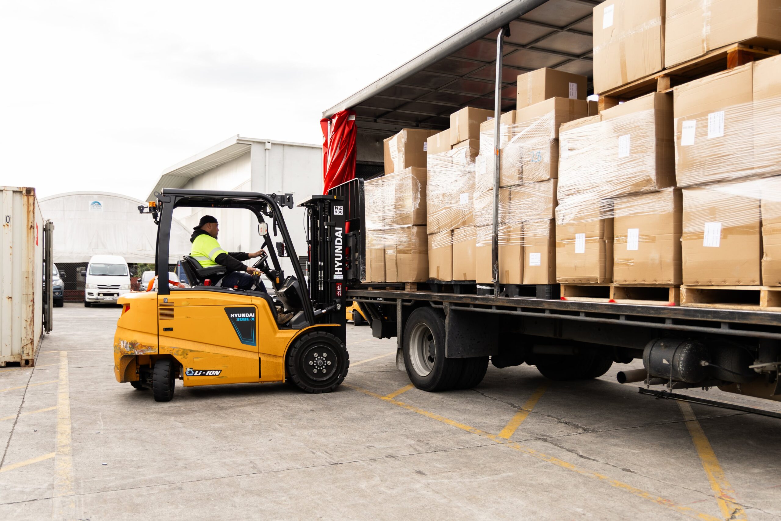 Forklift loading boxes in truck